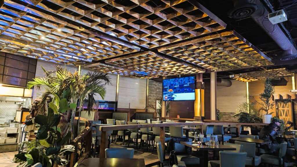 Dining room at Arizona Grill Lounge in Etobicoke with tables, lounge chairs and TVs